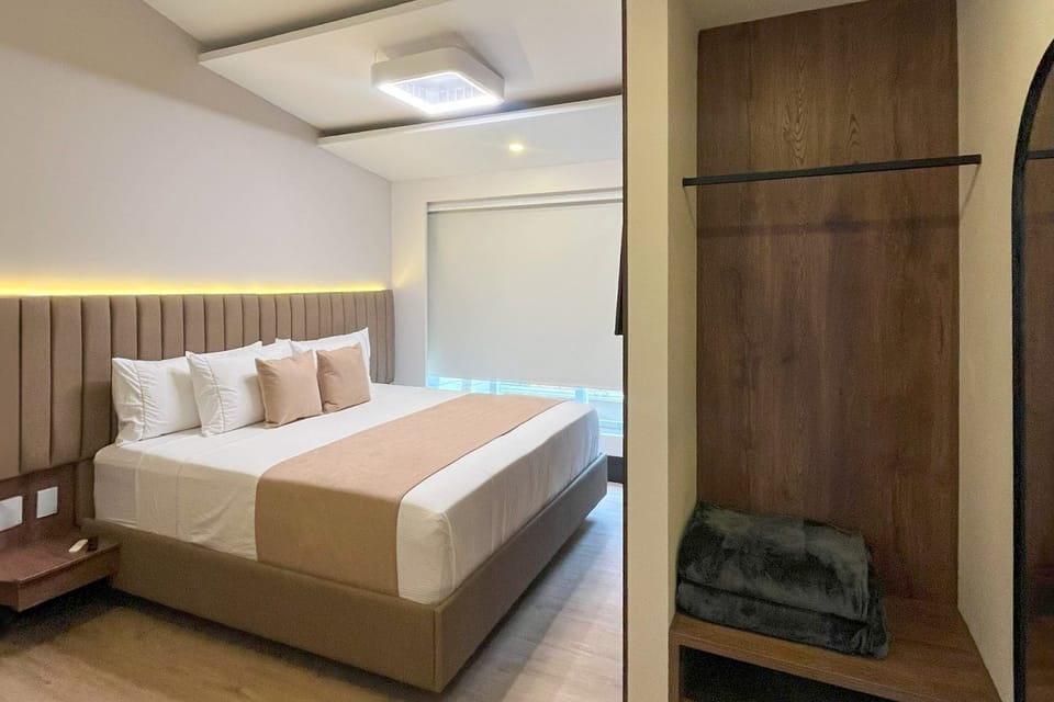 Deluxe Room, 1 King Bed | Minibar, desk, laptop workspace, soundproofing