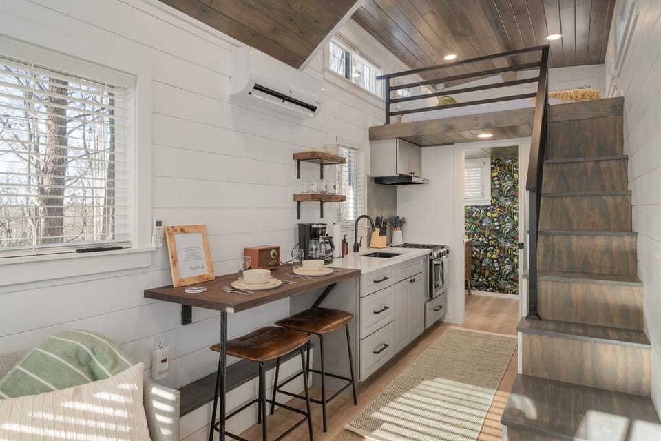 Bathroom and kitchenette area at Frost — efficient layout making the most of the tiny home footprint