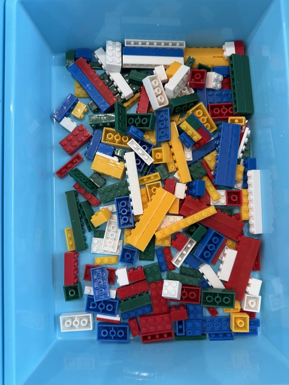 Lego table in the shared game room — separate building a short walk from Frost, open to kids and adults alike