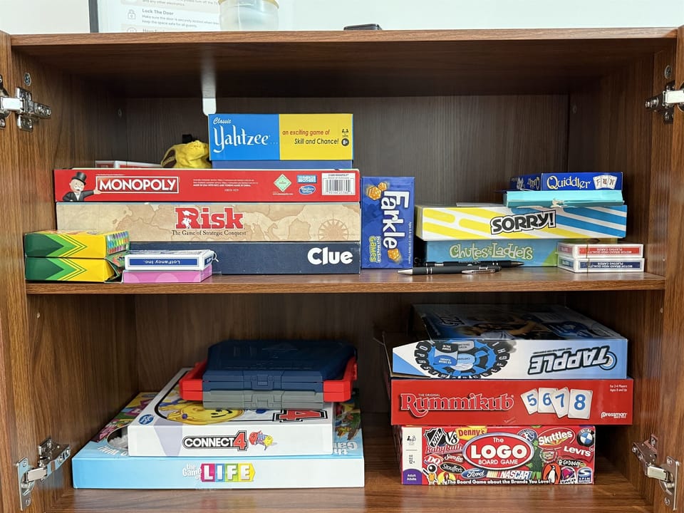 Board game library in the shared game room — Monopoly, Risk, Sorry, Clue, Yahtzee, and more, all include