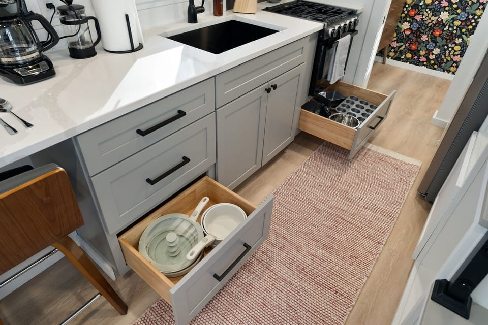 Kitchenette close-up at Yeats — counter space, sink, stovetop essentials, and pantry basics stocked on arrival