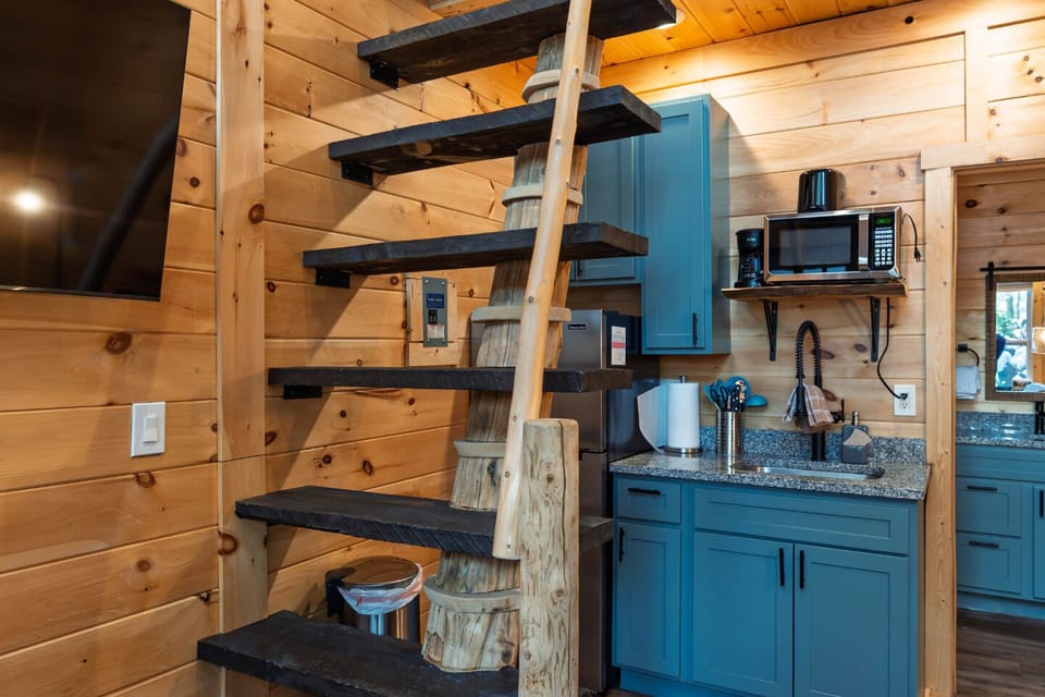 Stunning rustic decor with a spiral staircase and bright, airy charm awaits you!
