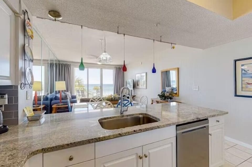 Kitchen has GULF VIEWS, granite countertops, stainless appliances - fully stocked with more than the basics - NEW PHOTOS COMING SOON!