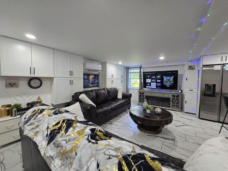 Business Apartment | Living area | 65-inch Smart TV with digital channels