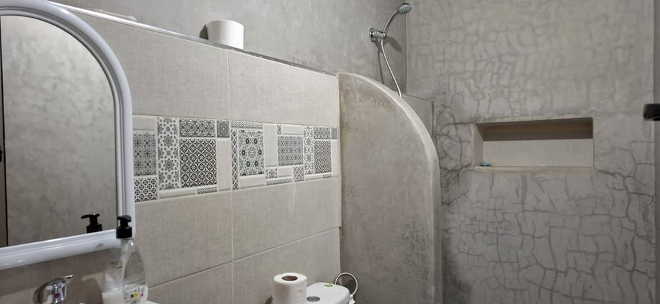 Deluxe Bungalow, Multiple Beds, Partial Ocean View | Bathroom | Shower, towels, toilet paper