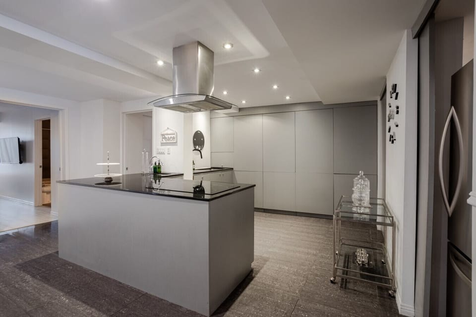 Kitchen: Sleek island kitchen with modern finishes.