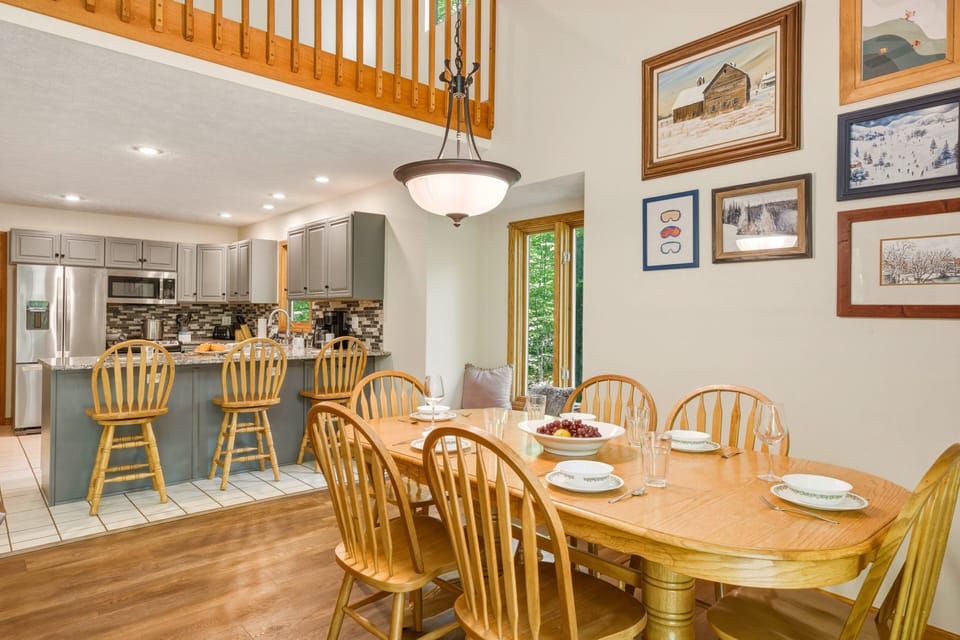 Gather around the dining table for shared meals, easy conversation, and cozy cabin moments just steps from the kitchen.