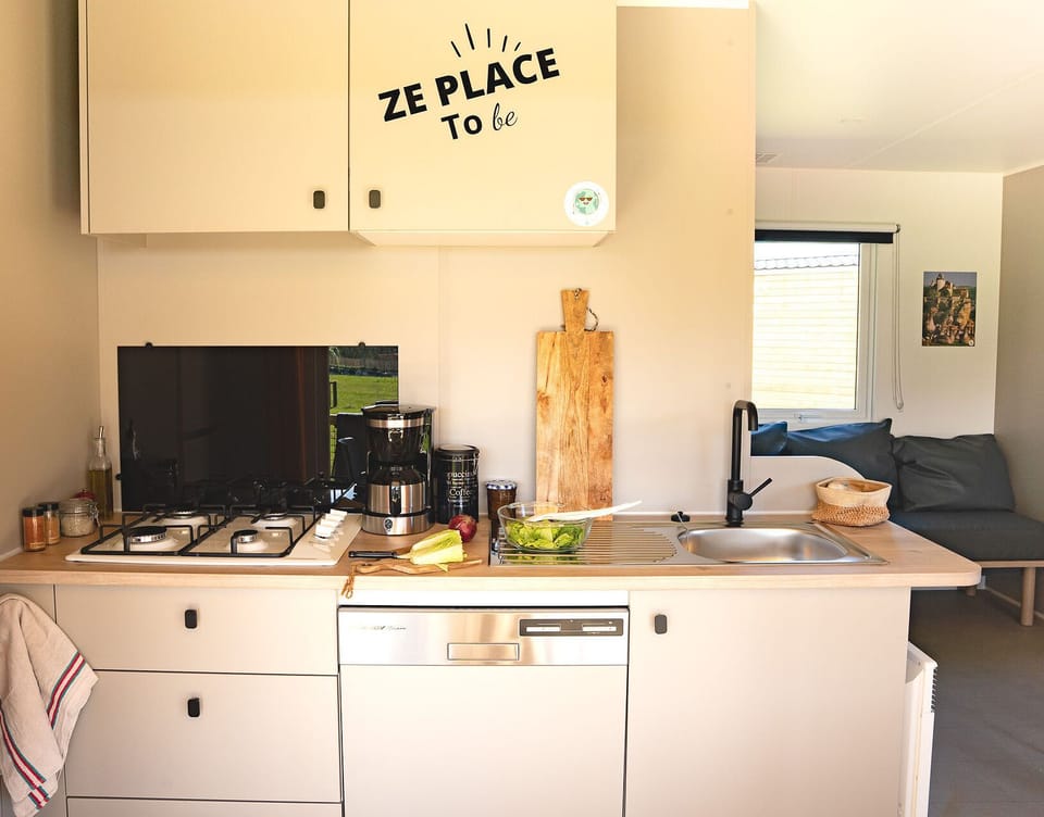 The contemporary kitchen blends functionality with charm, making meal preparation a joyful experience for the entire family.
