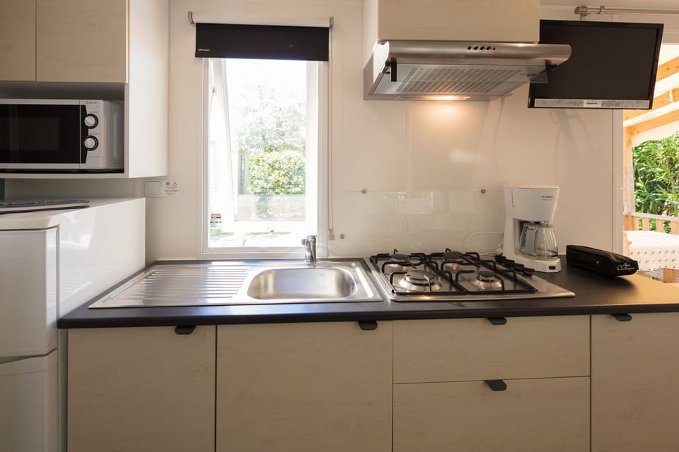 Cook your favorite meals in the fully equipped kitchenette with modern appliances.