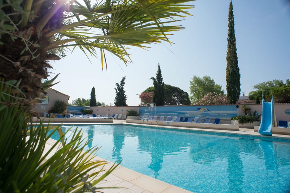 Relax by the outdoor pool surrounded by nature and Mediterranean charm.