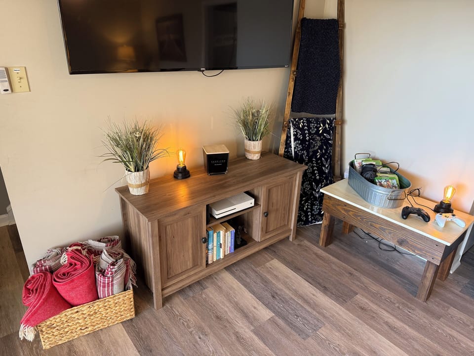 X Box, 75 inch TV and fire pit shows found in the Below Decks Lounge 