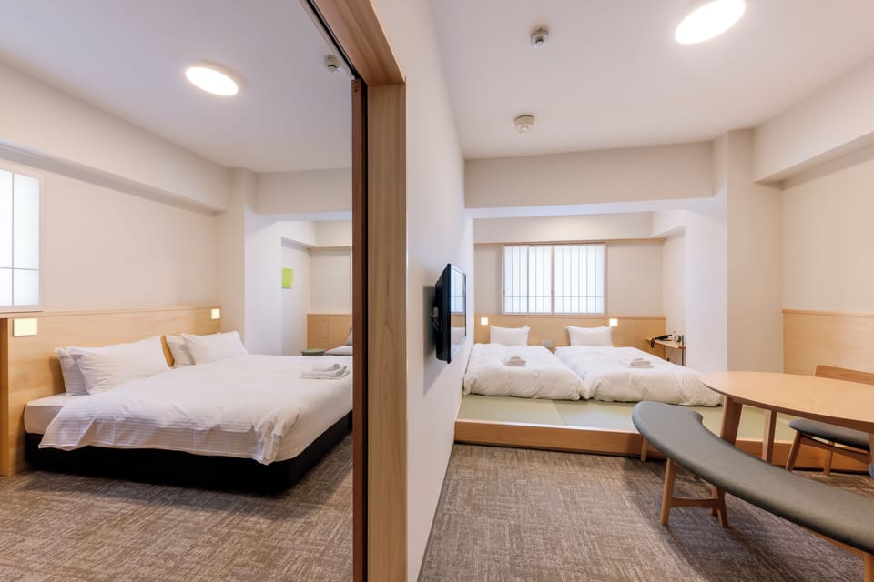 Two-Bed Room Family Apartment, Non Smoking | Down comforters, in-room safe, blackout drapes, soundproofing