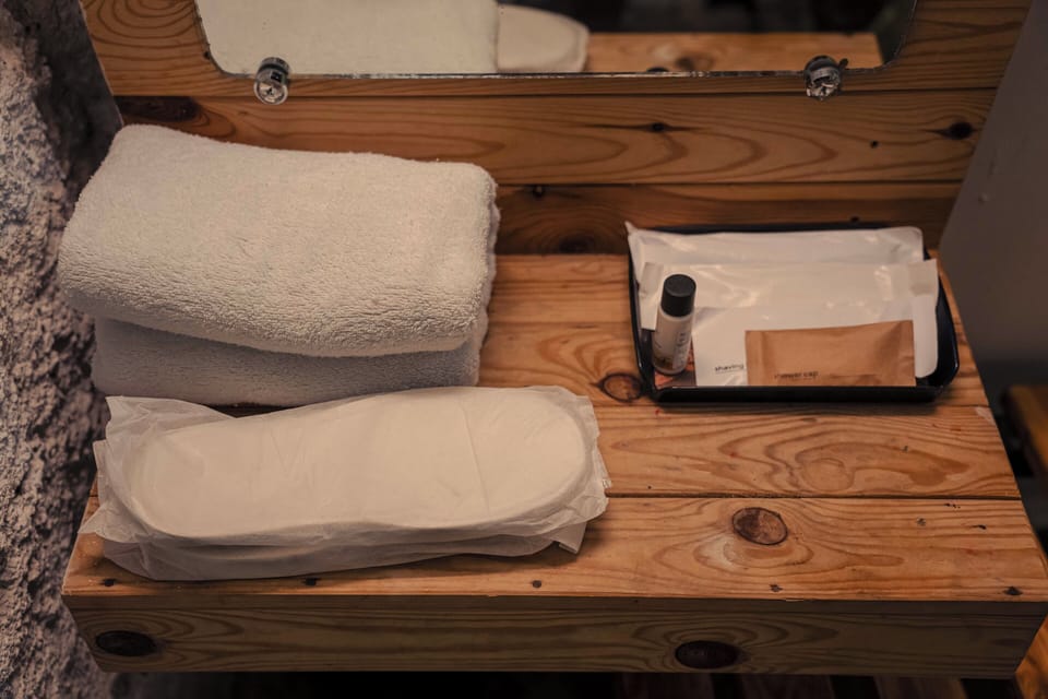 Deluxe Suite | Bathroom | Designer toiletries, slippers, towels, soap