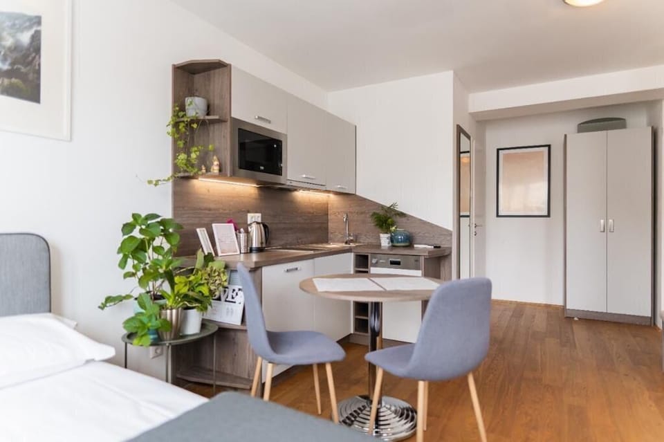 Deluxe Quadruple Room, Balcony | Living area | 60-cm Smart TV with cable channels, heated floors, printers
