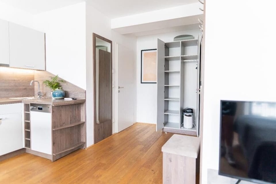 Deluxe Quadruple Room, Balcony | Living area | 60-cm Smart TV with cable channels, heated floors, printers