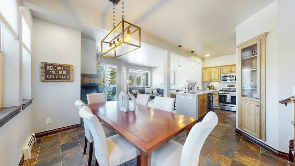 Dining table - Enjoy a conversation from the dining table to the person in the kitchen.