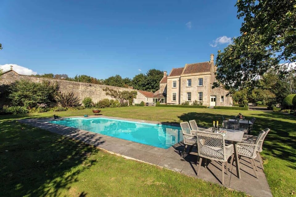 Private swimming pool with fire pit and alfresco dining, perfect on a summery day