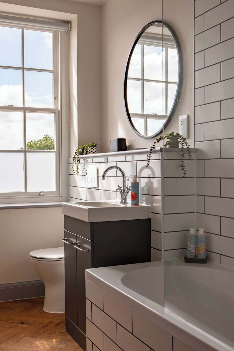 Main bathroom. Bath with overhead shower and WC.