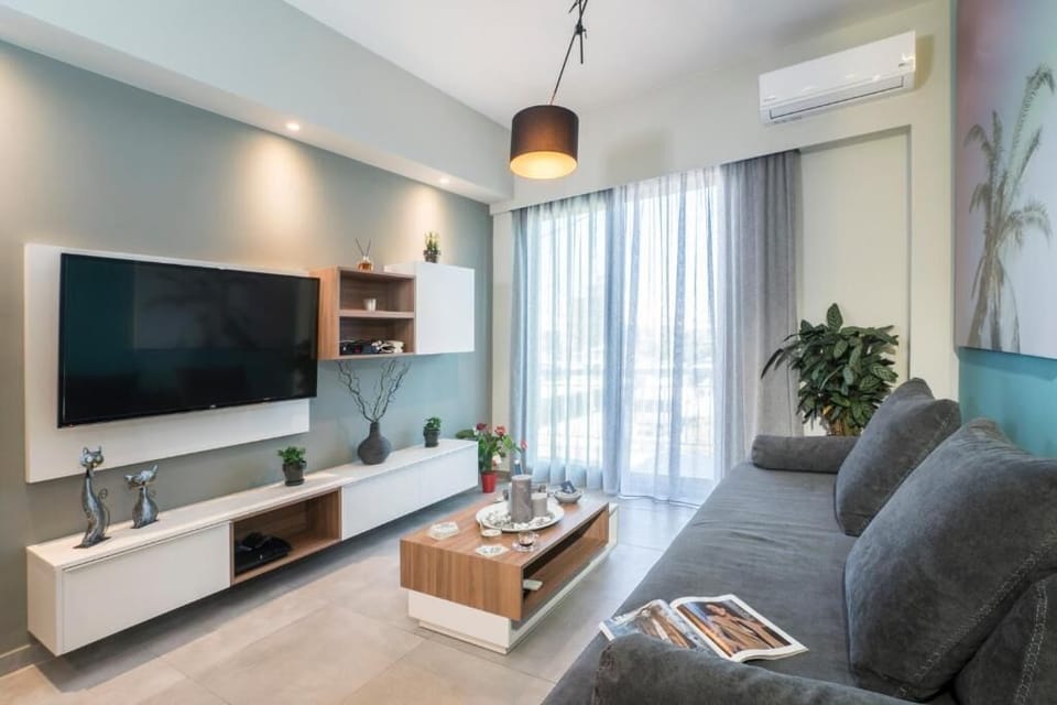 Luxury Apartment, City View | Living area | 55-inch Smart TV with satellite channels, video-game console