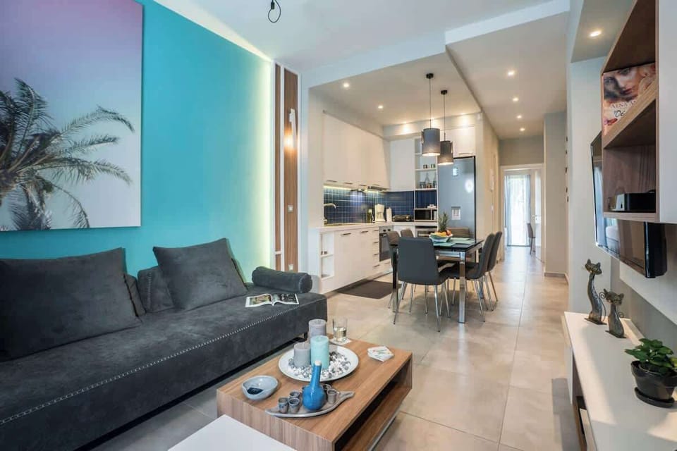 Luxury Apartment, City View | Living area | 55-inch Smart TV with satellite channels, video-game console