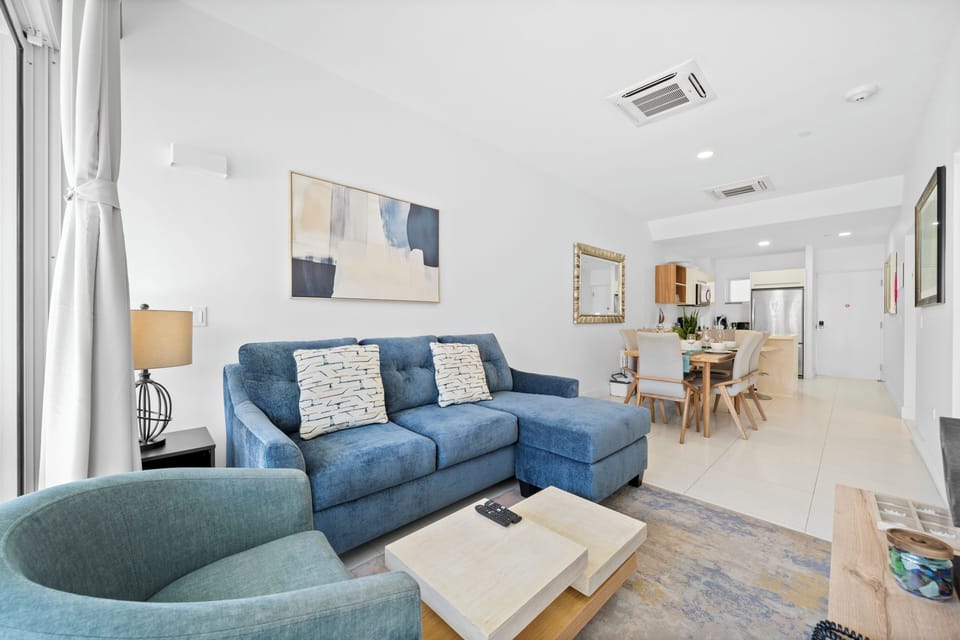 stylish living room with a smart TV and sofa bed