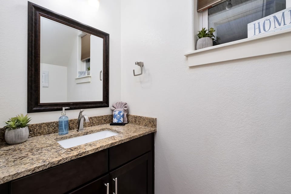 This half Bathroom #5 is located off of the kitchen and living areas.
