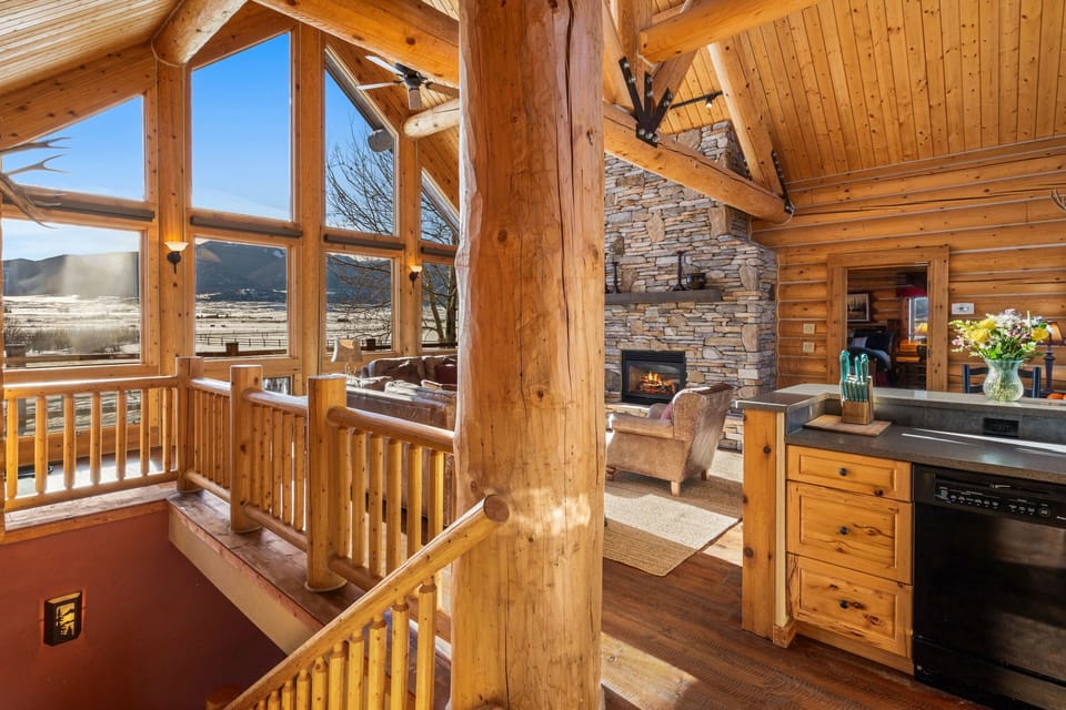 Let the light and mountains shine in this gorgeous grand living room
