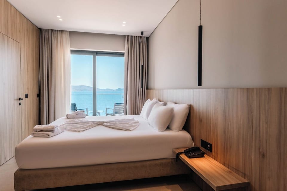 Deluxe Triple Room, Balcony, Sea View | Minibar, in-room safe, desk, blackout drapes