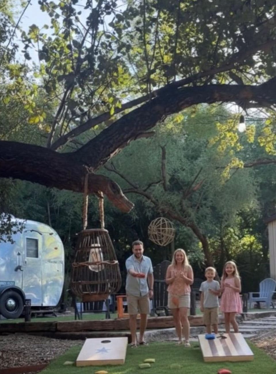 TinyCamp offers welcoming outdoor spaces where families can enjoy lawn games, gather beneath the trees, and create lasting memories together.