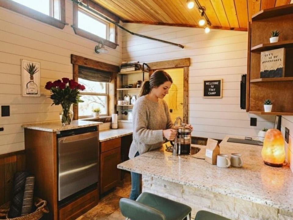 Prepare meals with ease in the fully equipped kitchen featuring modern appliances, cookware, coffee station, and everything you need for a comfortable stay.