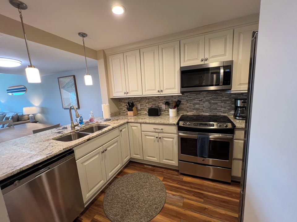 Kitchen w/ stainless steel appliances