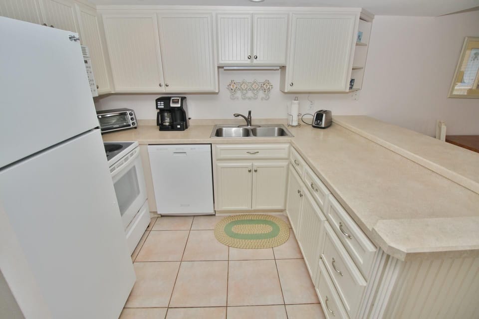 Condo, Multiple Beds (Ocean Club North C208) | Private kitchen | Oven, coffee/tea maker, toaster, blender