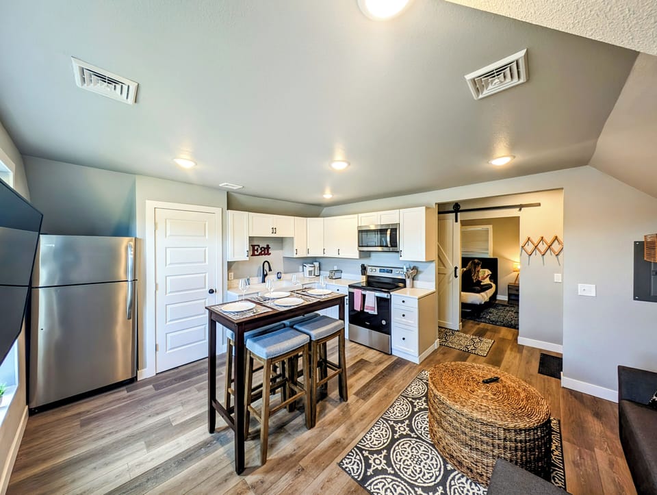 Private upstairs apartment with sofa bed, Roku TV, and fully stocked kitchen.