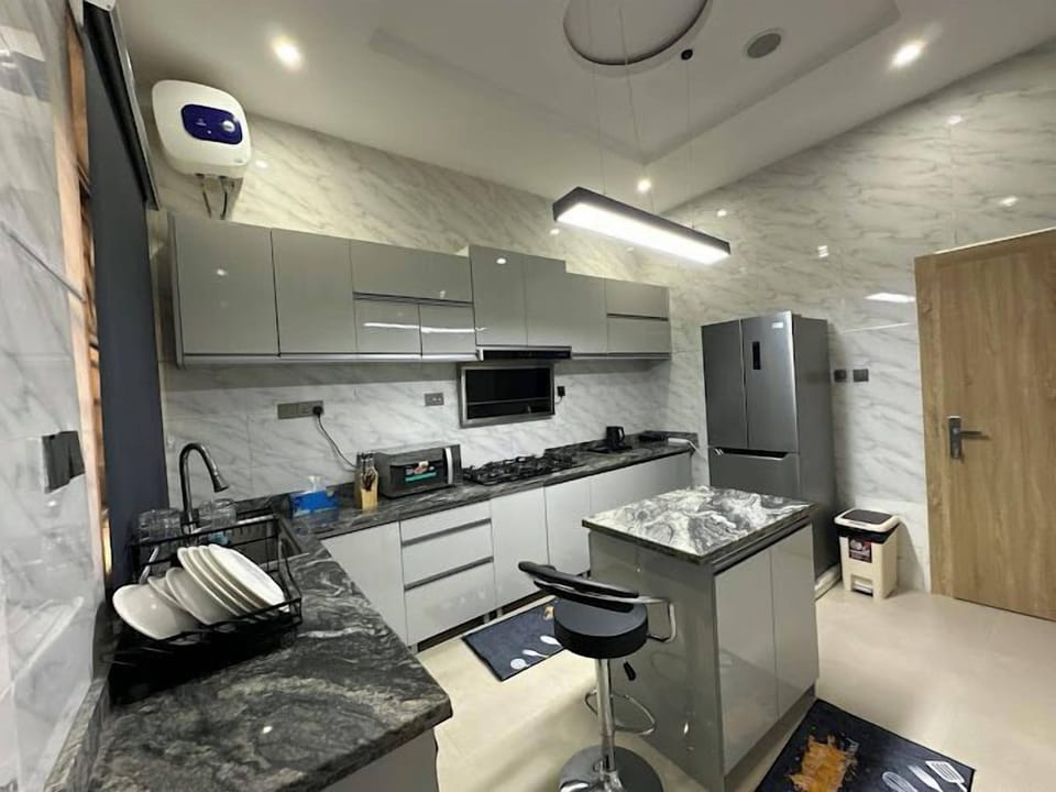 Family Apartment, Balcony, City View | Private kitchen | Fridge, microwave, oven, stovetop