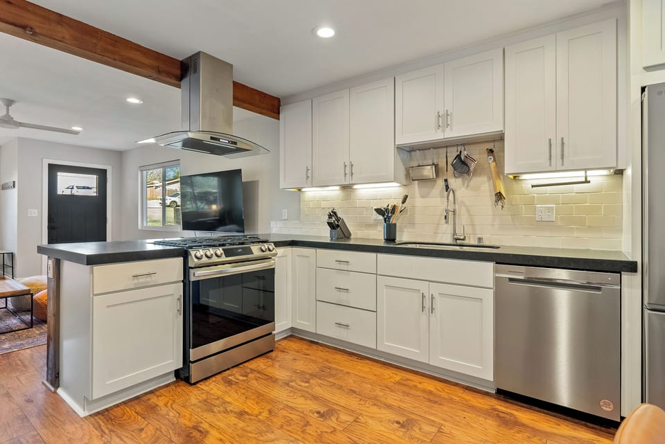 Prepare gourmet meals in this bright, modern kitchen equipped with premium stainless steel appliances and ample counter space. 