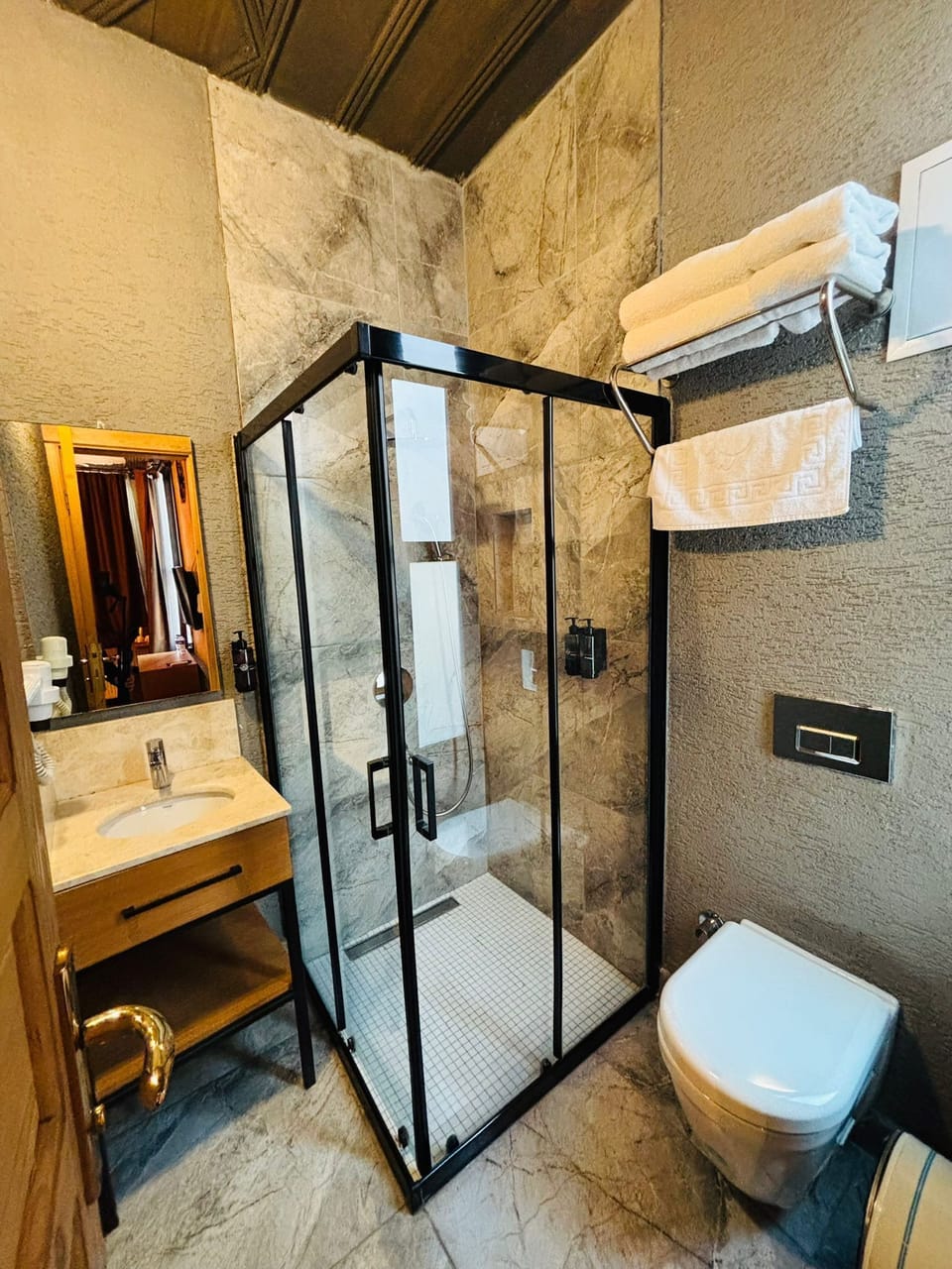 Shower, hair dryer, slippers, towels