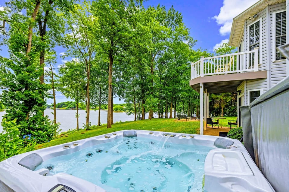 Sink into the hot tub with the lake in view, the perfect end to a day in the sun.