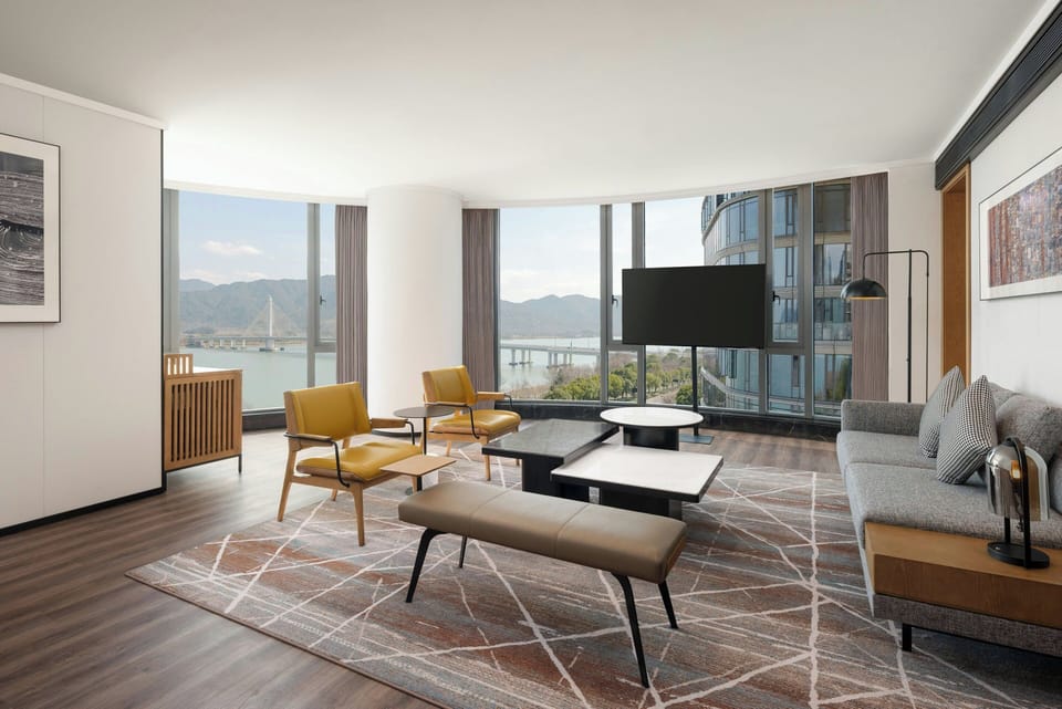 Executive Riverview Suite | Living room | 55-cm LCD TV with digital channels