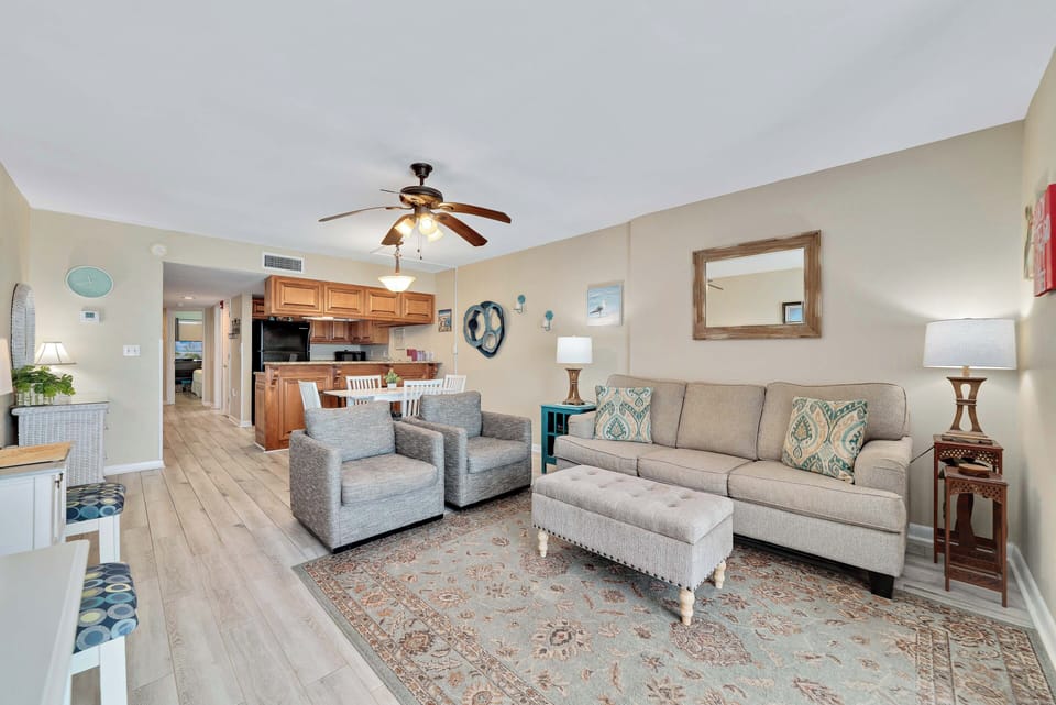 Living room with queen sized sleeper sofa plus 2 additional chairs.