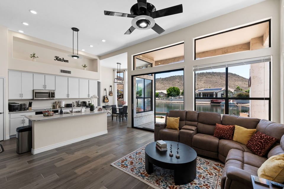 Bright open-concept living room with lake and mountain views