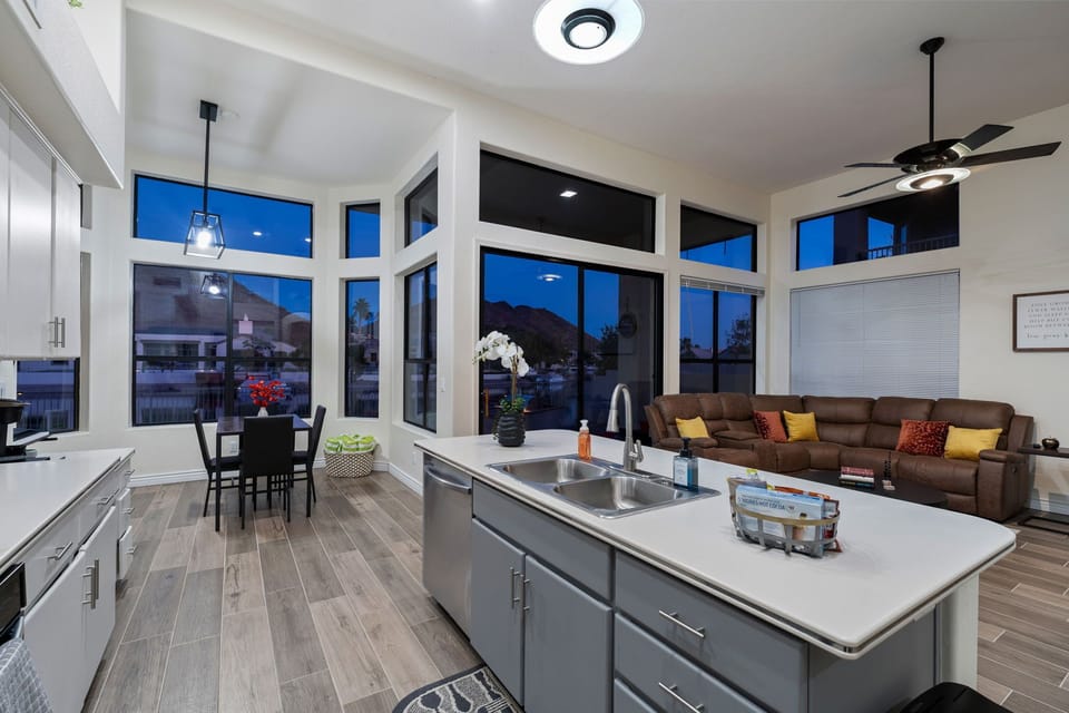Fully equipped kitchen with a central island, and a view of the cozy living