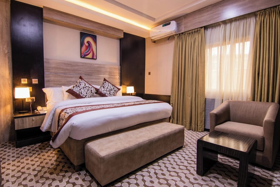 Economy Room, Balcony, City View | In-room safe, desk, laptop workspace, blackout drapes