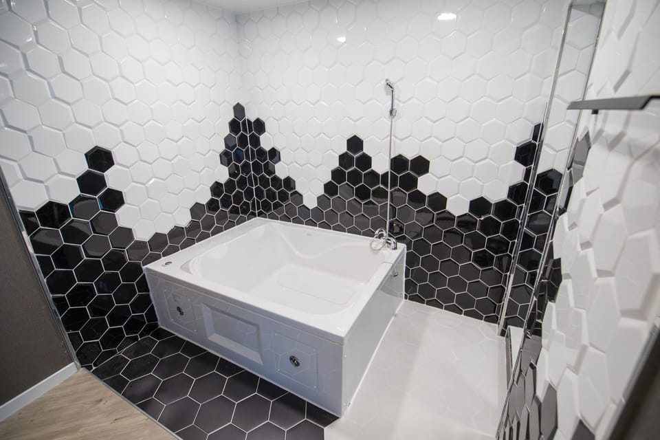 Premium Condo Ocean View, Floor-to-ceiling window, 2 Rooms, Ocean view available lying on bed | Bathroom | Free toiletries, hair dryer, towels, soap