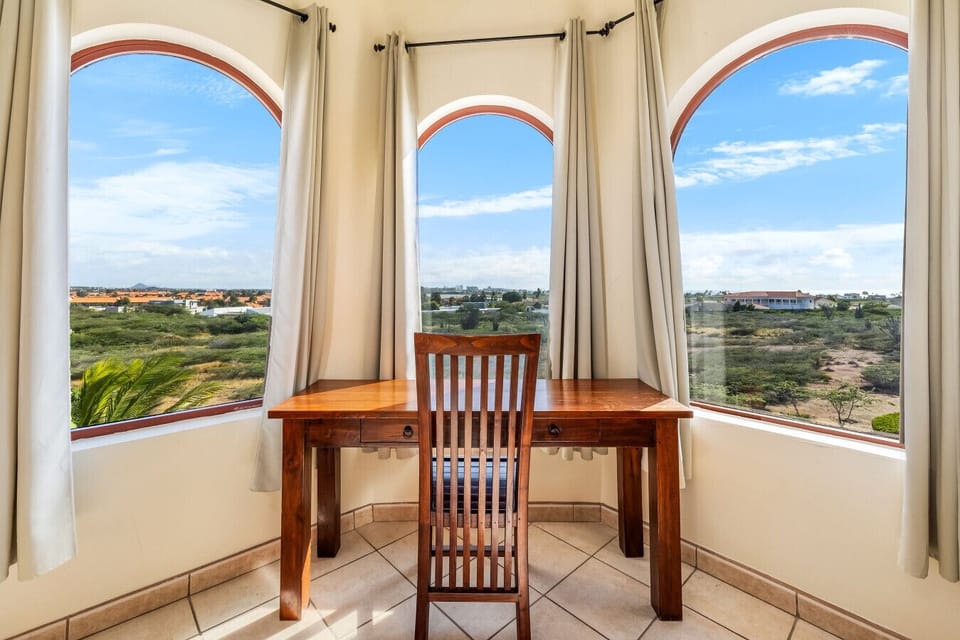 Enjoy a quiet moment at this charming workspace, surrounded by stunning views that inspire creativity and tranquility.
