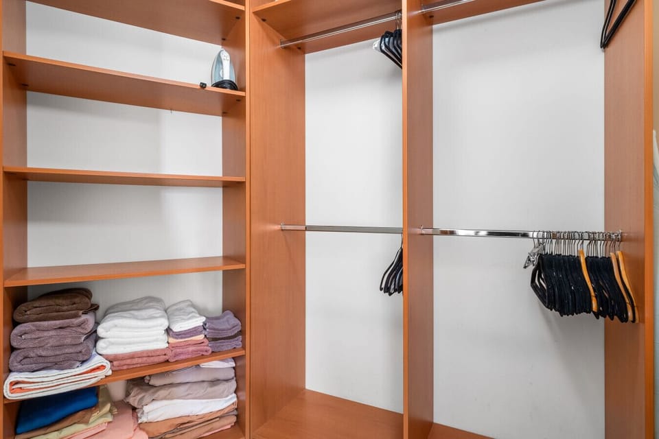 Stay organized in this spacious closet, designed to keep your essentials neatly stored and easily accessible.