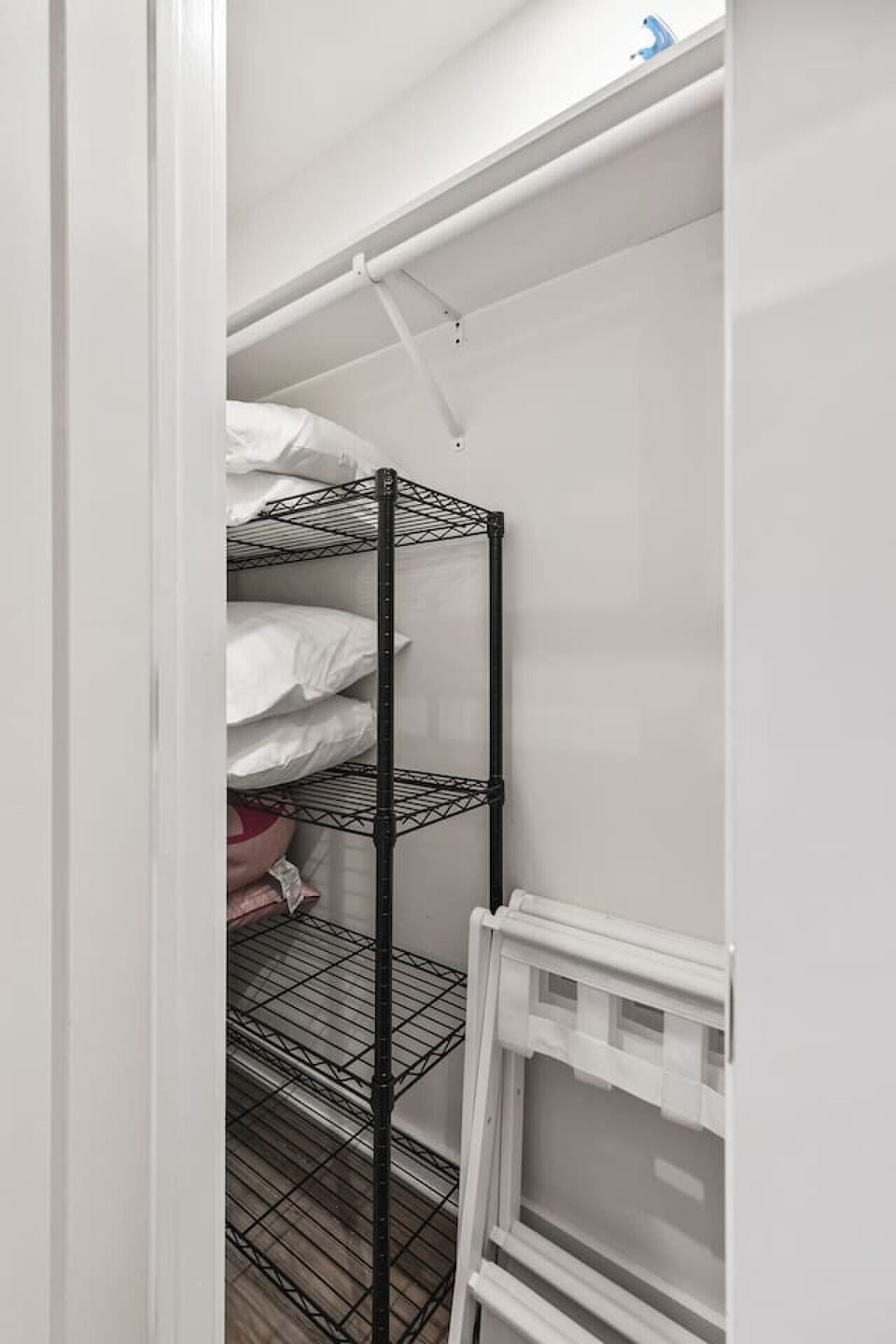 Closet with hangers and shelf + Extra pillows and blankets. Dresser to store your clothes in.