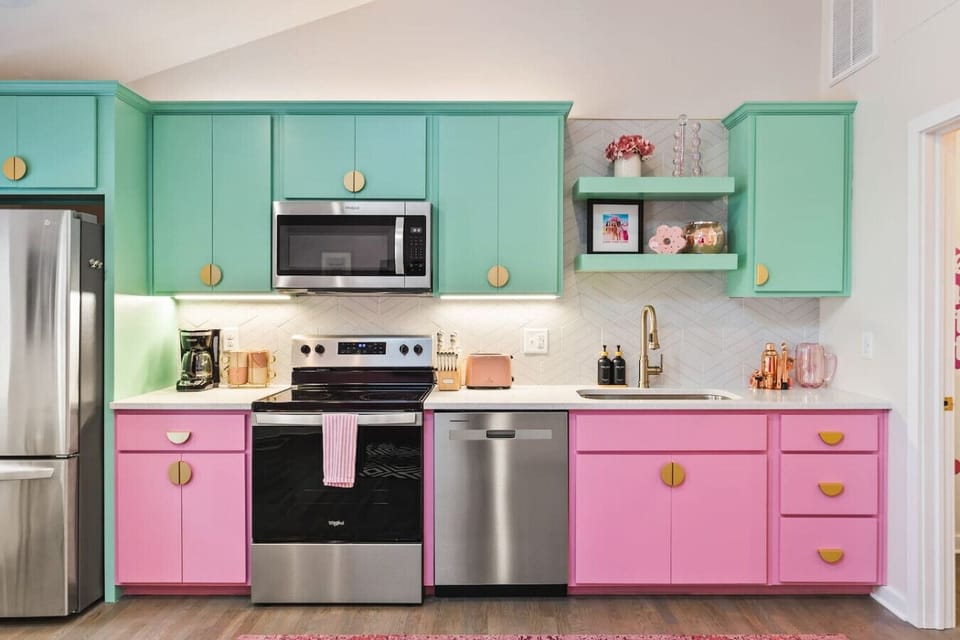 Fully equipped kitchen with all your cooking essentials, drip coffee maker + coffee. Dining table with seating for 2. This room opens up into the living room. Unique colors, wallpaper and decor all throughout the condo.