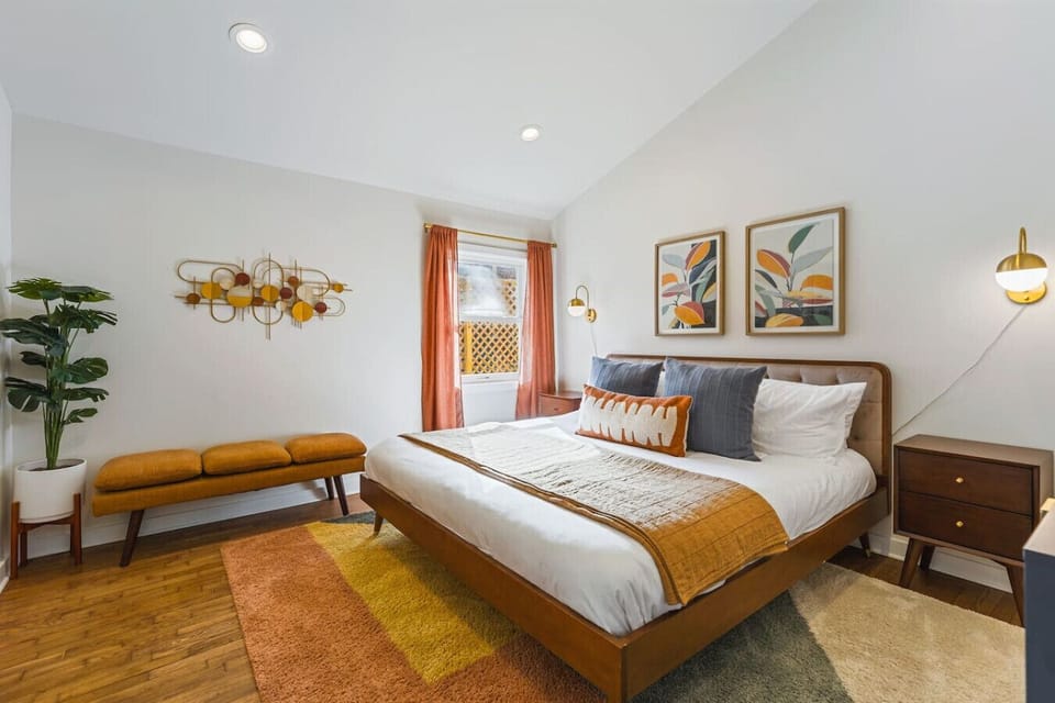 One King bed in the Bedroom. Cozy bench for relaxing, Full length mirror, Closet with hangers and shelf,  Dresser + Nightstands to store your items in.