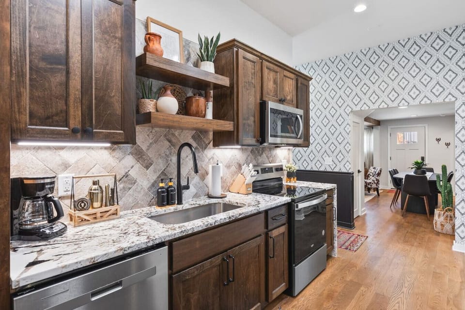 Fully equipped kitchen with all your cooking essentials, drip coffee maker + coffee. Dining table with seating for 6. This room opens up into the living room. Unique colors, wallpaper and decor all throughout the condo.