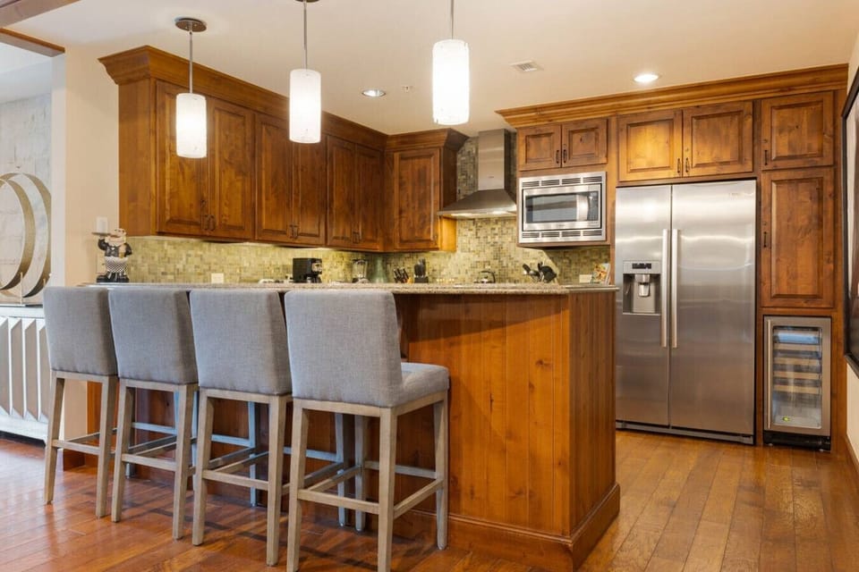 Fully Stocked Kitchen with Bar Seating